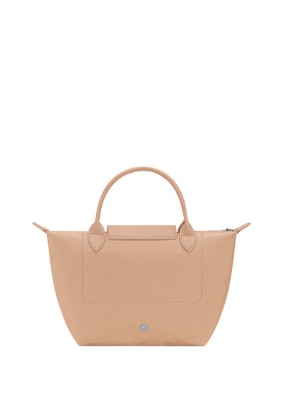 Beige leather handbag with rounded handles, zippered top, and small circular button detail on front center.