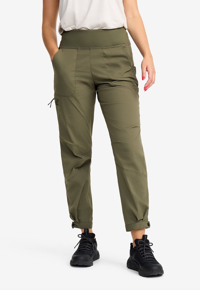 Olive green cargo pants with a wide, elastic waistband, side pockets, and adjustable cuffs. Made from lightweight, durable fabric. Black footwear.