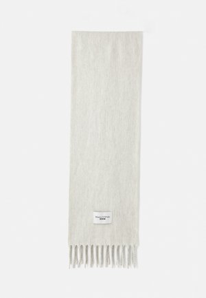 Light gray scarf made of soft fabric, featuring fringe ends and a small label with brand name, on a plain white background.