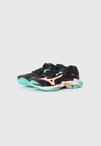 Black athletic shoes with turquoise, orange, and white accents; features a textured sole and distinct logo design.