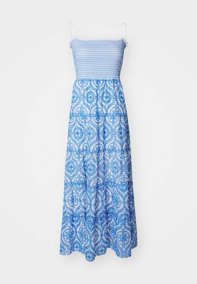 Vestido maxi com corpete justo, alças nos ombros e saia fluida em camadas. Apresenta um padrão floral intrincado em azul e branco. Tecido de algodão.
