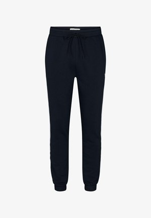 Jūros pajėgų stiliaus sportiniai džinsai su raišteliu, kulkšnies apkaustais ir baltais šonais, pagaminti iš minkštos, tekstūruotos medžiagos.