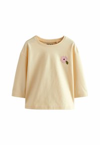 Korte mouwen, lichtgele katoenen t-shirt met een roze geborduurd bloem en groene bladdetail op de linkerborst.