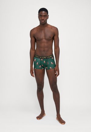 Boxer cortos verdes con un estampado floral, que presentan una cinturilla negra con el logo "POLO RALPH LAUREN" en dorado. Tela suave y elástica.