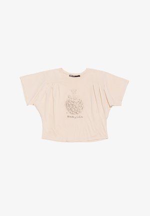 T-shirt en coton beige à manches courtes avec une coupe loose, présentant des manches bouffantes et un imprimé floral au centre avec le nom de la marque en dessous.