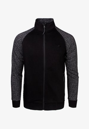 Giacca nera con chiusura a zip e maniche grigie a motivo testurizzato. Presenta tasche laterali e un colletto alto. Realizzata in tessuto morbido.