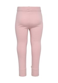 Leggings rose clair en coton doux avec une taille extensible, coupe ajustée et ourlets resserrés, présentant une texture lisse et sans motifs.