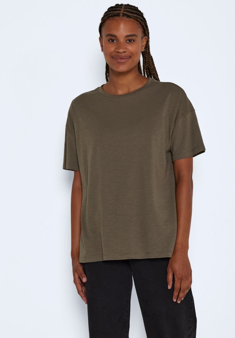 Olive green T-shirt made of soft fabric, featuring a relaxed fit, short sleeves, and a crew neckline, paired with black pants.