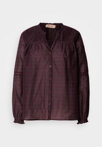 Blouse longue manches en voile violet foncé avec fines rayures horizontales, boutonnage devant, détails froncés, col et poignets volantés.