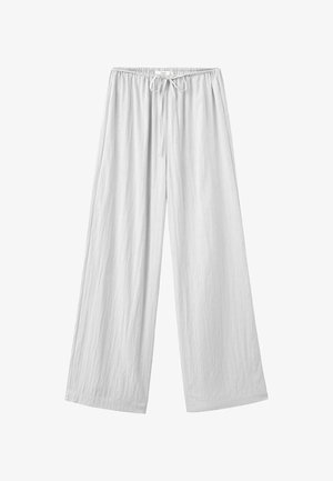 White loose-fit pants with elastic waistband and front drawstring, made of lightweight fabric.