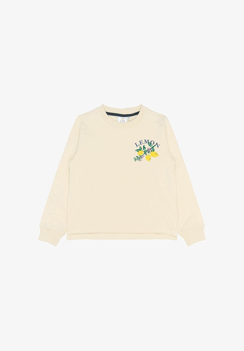 Sweatshirt crème à manches longues avec des poignets côtelés. Présente le texte "LEMON" en vert et des illustrations de citrons et de feuilles à l'avant.