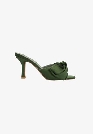 Green satin heeled mules with a bow detail on the front, open toe, and a slender stiletto heel in a contrasting light brown.
