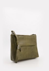 Olive green leather messenger bag with a smooth surface, adjustable strap, flap closure, and embossed logo on the front.
