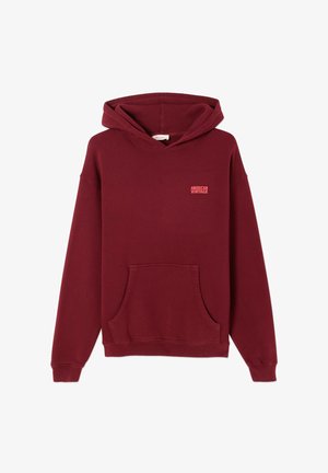 Bordeauxfärgad hoodie i mjuk bomull, med en framficka i kängurustil, dragsko vid huvan och en liten "American Vintage"-logotyp på bröstet.
