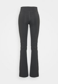 Svarta förstärkta träningsbyxor med hög midja, tillverkade av elastiskt material, med flatlock-sömmar och en slät yta.