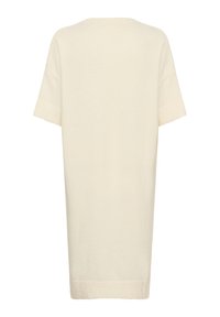 Robe en tricot de couleur crème, à manches courtes, avec une coupe décontractée et des détails côtelés sur les manches et l'ourlet, vue de dos.