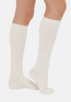 Knee-high socks in a white textured knit, featuring a subtle diagonal pattern and ribbed cuffs, made from a soft fabric for comfort.