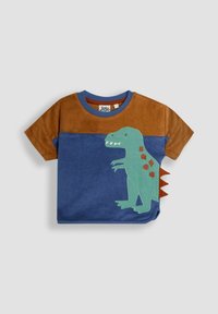 Krekliņš brūnā un zilā veidā ar zaļu dinozaura grafiku un sarkanām ādām sānos. Kontrastējoša ribota apaļa kakla izgriezuma forma.