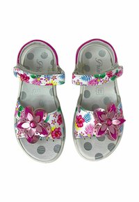 Sandali bianchi con motivi floreali e dettagli rosa. Presentano pois sulla soletta e un fiore decorativo sulla fascia. Chiusura regolabile.