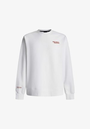 Bílá mikina s žebrovanými manžetami a lemem, s červeným nápisem "RED BULL RACING" na přední straně a levém rukávu. Měkký bavlněný materiál.