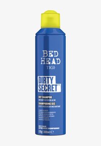 Lattina aerosol blu di shampoo secco con un tappo giallo, con etichette bianche che riportano: "BED HEAD" e "DIRTY SECRET." Capacità di 300 ml.
