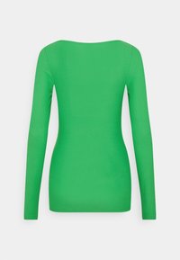 Ljusgrön långärmad åtsittande topp med båthals, visad bakifrån mot en vit bakgrund.