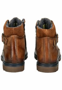 Botas de tobillo de cuero marrón con forro de fieltro gris suave, forma redondeada, cremalleras laterales y suela de goma texturizada para mayor agarre.