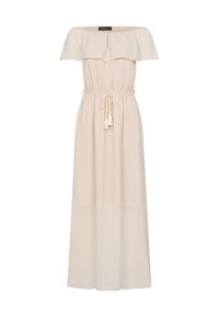 Robe longue beige épaules dénudées avec un col à volants et une ceinture à la taille nouée avec des pampilles.