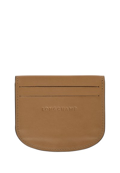 Brown leather card holder with rounded edges, embossed "LONGCHAMP" logo, and three card slots on the front. Smooth texture and clean design.