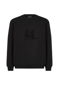 Felpa nera realizzata in tessuto morbido, caratterizzata da un logo "KL" nero peloso decorato con paillettes. Collo a giro, maniche lunghe e polsini a costine.