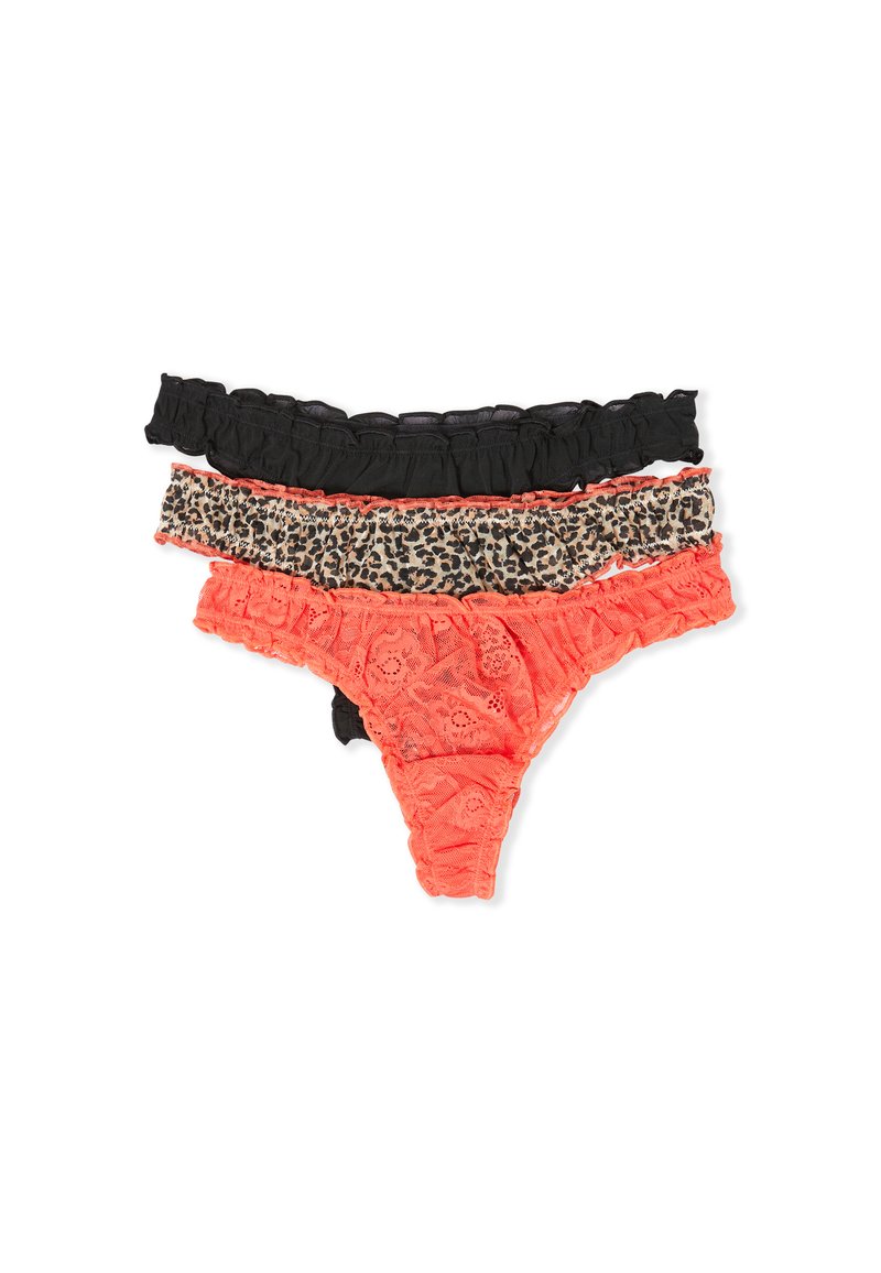 Three women's lace thong panties stacked: black, leopard print, and coral red with floral lace pattern on a white background.