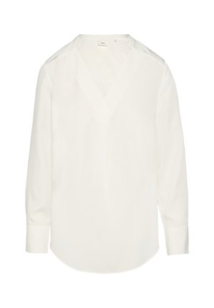 Camicia bianca a maniche lunghe con scollo a V, realizzata in tessuto morbido. Presenta un orlo curvo e un dettaglio con bottoni vicino al collo. Design semplice.