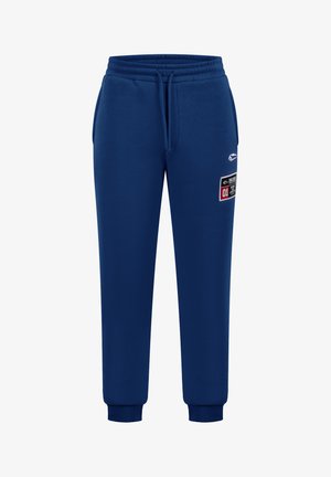 Marineblaue Jogginghosen aus weichem Stoff; elastischer Bund mit Kordelzug; gerippte Bündchen; mit Logo- und Patchdetails an der Seite.