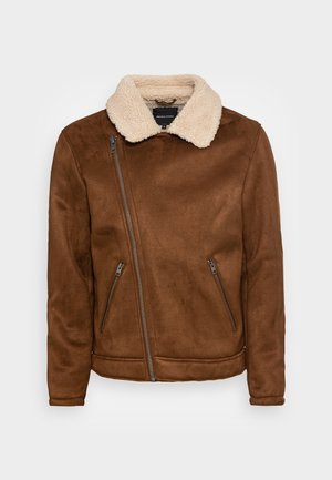 Brown faux suede jacket with a shearling collar, zippered side pockets, and a diagonal zip closure. Smooth texture, mid-length design.