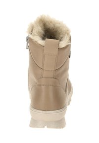 Hellbraune Leder-Ankle-Boots mit einem Kunstfellfutter oben, gepolstertem Kragen und einem seitlichen Reißverschluss. Gummisohle mit strukturiertem Grip.
