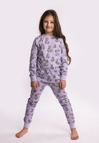 Lilac loungewear set featuring a long-sleeve top and pants, both adorned with a repeating rabbit and cactus pattern. Soft fabric, ribbed cuffs.