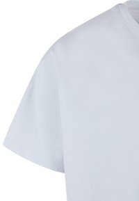 Plain white t-shirt with short sleeves, made of cotton material. Features a crew neckline and smooth, even texture.