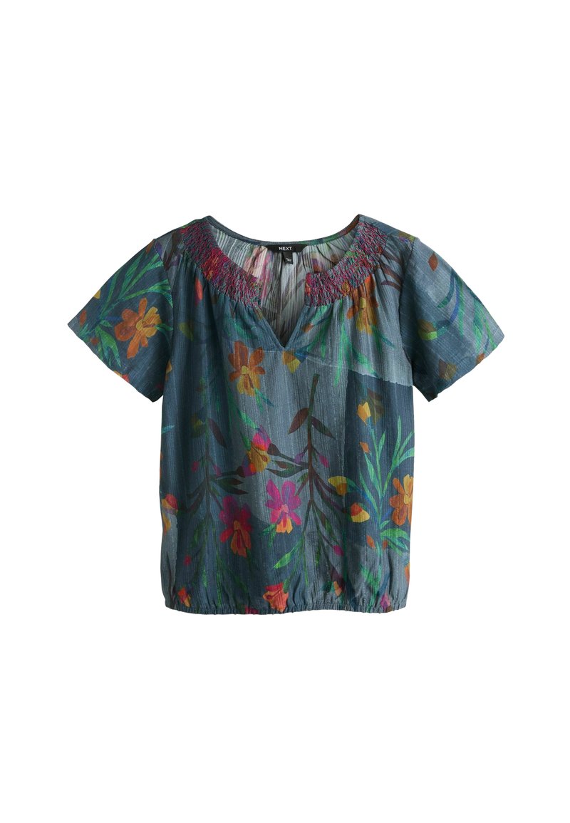 Bluza cu mânecă scurtă și vedere în V, de culoare albastru închis, cu modele florale colorate, decolteu cu smock și croială lejeră cu tiv elastic.