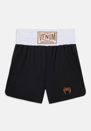Μαύρα μποξέρ Venum με λευκή ελαστική μέση και καφέ λογότυπο φιδιού στο αριστερό πόδι.