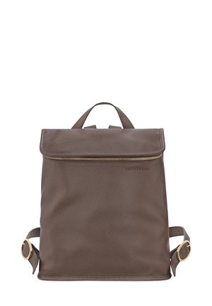 Brown leather backpack with a textured finish, zipped top closure, adjustable straps, and a small top handle. Logo embossed on the front.