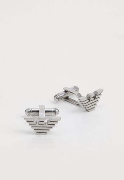Silver-toned cufflinks designed with layered rectangular shapes, featuring a polished metal finish and cylindrical accents on the ends.