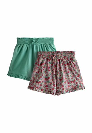 Dva páry dievčenských šortiek s elastickým pásom, jedny jednofarebné mätovo zelené, druhé ružové s motívom jahôd a kvetín, obe s volánikovými okrajmi.