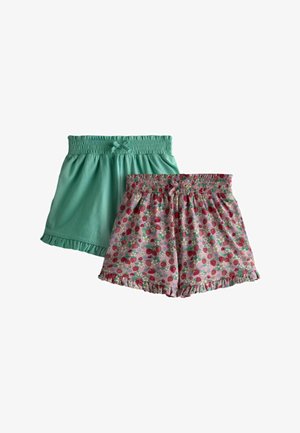 Două perechi de pantaloni scurți elastici pentru fete, unul verde mentă uni, celălalt roz cu model de căpșuni și flori, ambele având tivuri cu volane.