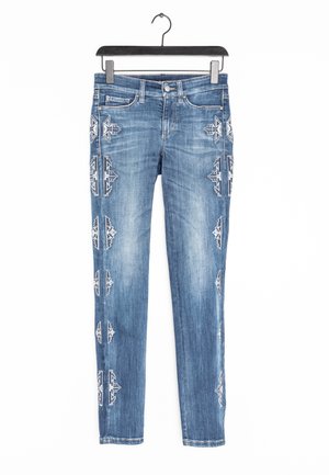 Blue denim jeans with a slim fit, featuring white geometric embroidery on the sides and a classic five-pocket design.