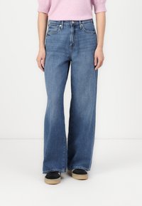 Blue wide-leg jeans with a high waist, made from denim fabric. Features two front pockets and a classic five-pocket design.