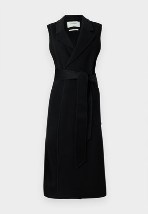 Black sleeveless wrap dress made of smooth fabric, featuring a belted waist, wide lapels, and two side pockets. Simple, elegant design.