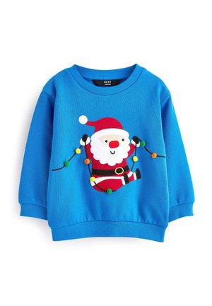 Blå børnesweater med en smilende julemand, der holder julelys i røde, hvide, sorte og flerfarvede pomponer.