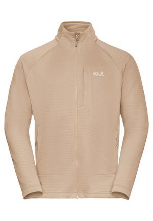 Giacca in pile beige con tessuto strutturato, cerniera completa, collo alto e tasca sul petto a sinistra. Presenta il logo Jack Wolfskin sul fianco.