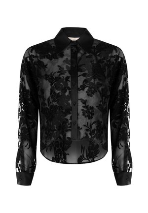 Blouse noire en voile avec broderie florale, fermeture à boutons devant, col, manches longues et ourlet raccourci. Texture lisse avec des poignets structurés.