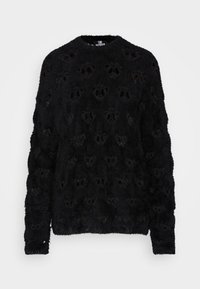 Pull noir en velours avec une finition texturée, présentant un design en dentelle et des manches longues. Encolure ronde avec une apparence douce et confortable.